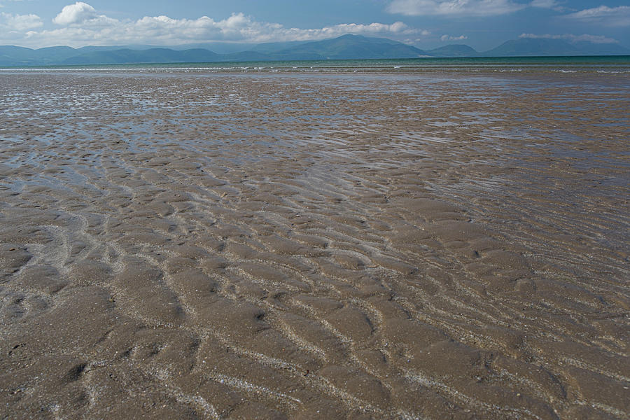 Patterns in the sand made by wave action at Inch Beach Photograph by David L Moore