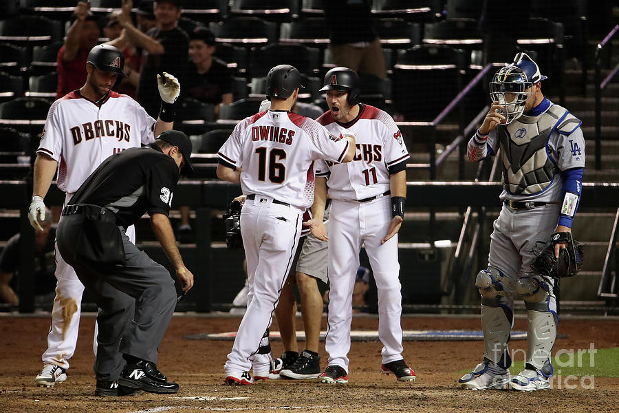 Paul Goldschmidt and Chris Owings Photograph by Christian Petersen
