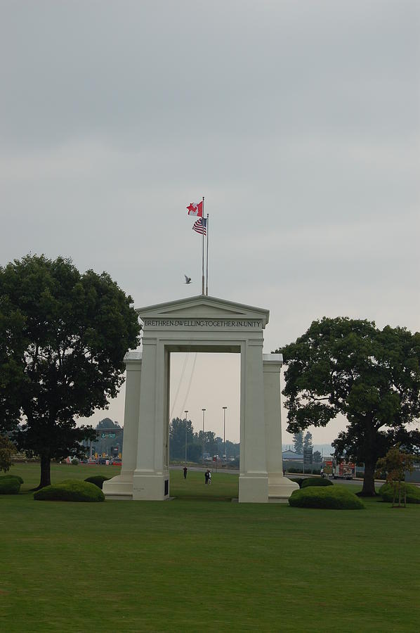 Peace Arch With Flags Photograph by James Cousineau