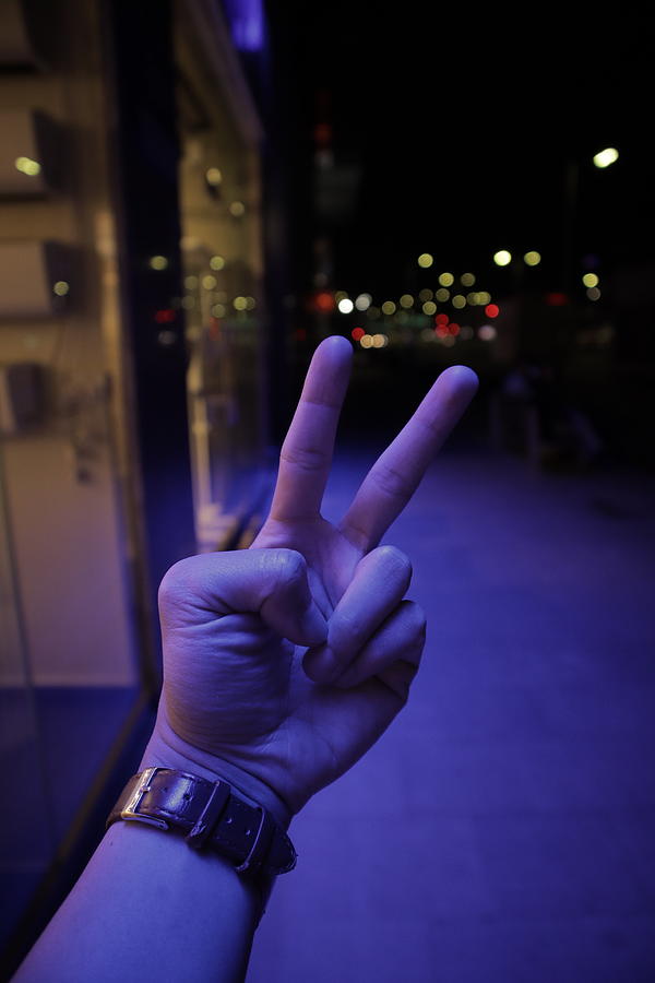 Download Peace Sign In A Colorful Lighting Background At Night Photograph By Aldrin Yabut