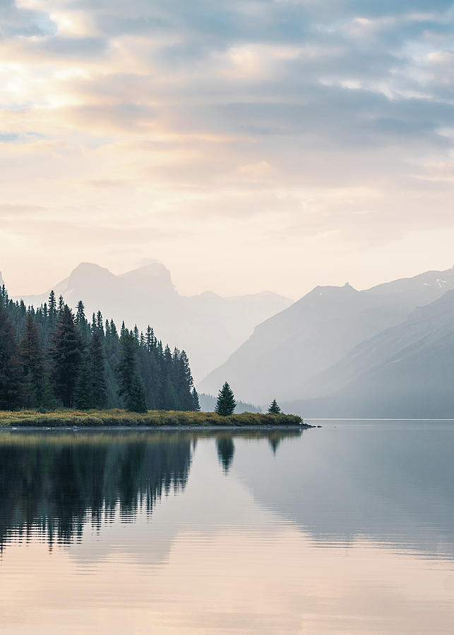 Peaceful sunrise over Maligne Lake in Jasper National Park in Canada Photograph by Peter Kolejak