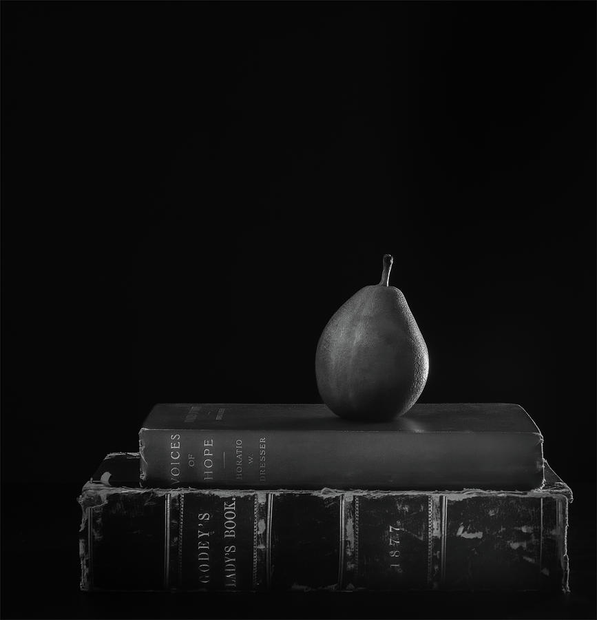 Pear on Books Photograph by Sylvia Goldkranz