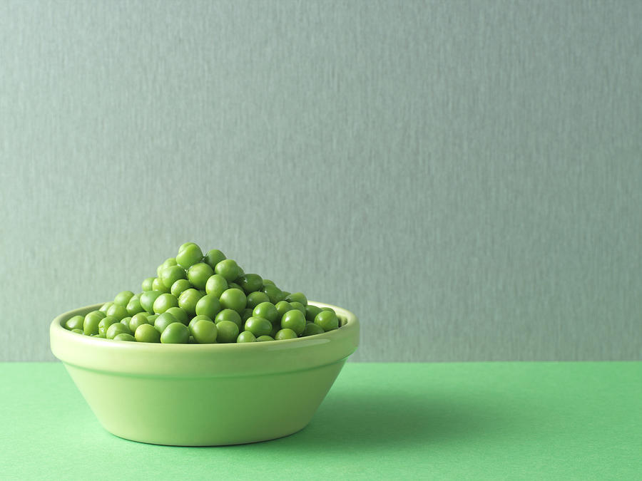 Peas in a bowl Photograph by Image Source