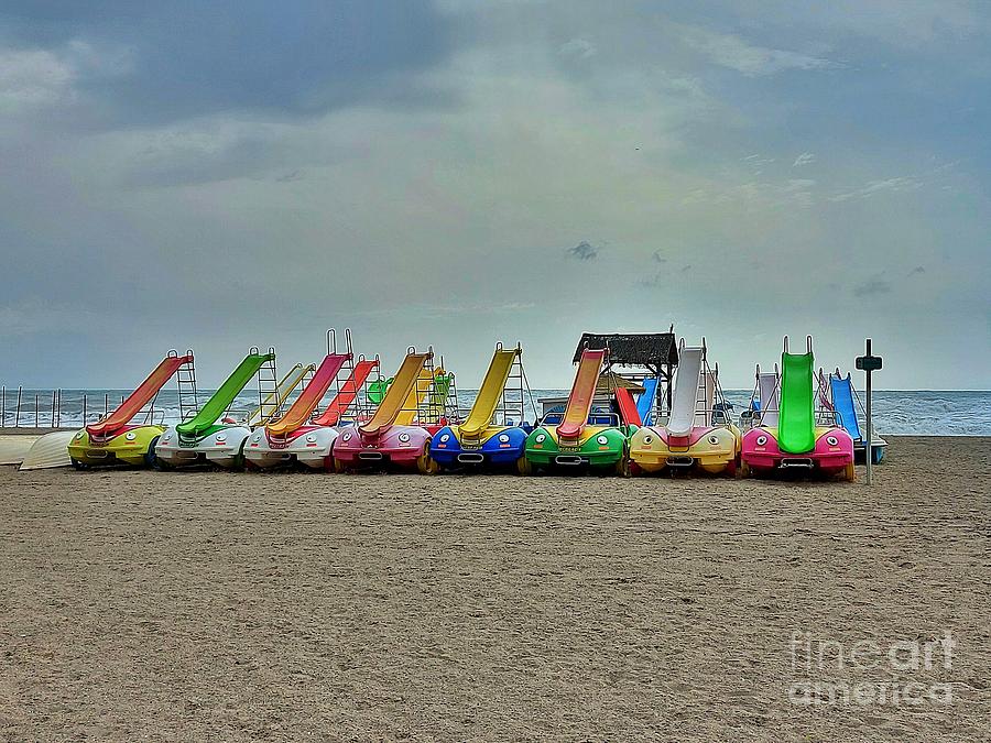 Pedal boats on empty beach Photograph by Chani Demuijlder