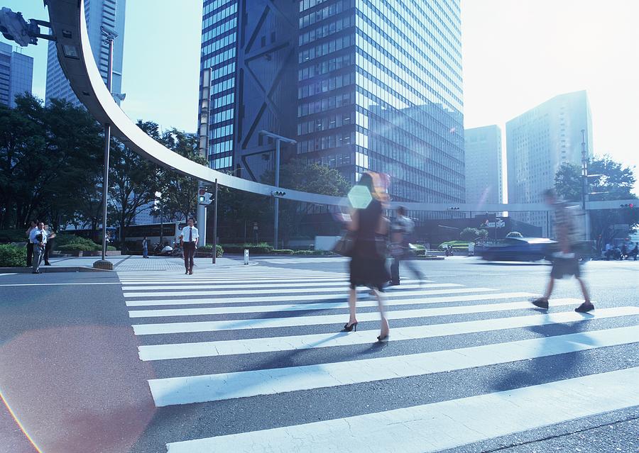 Pedestrian crossing in city Photograph by Imagenavi