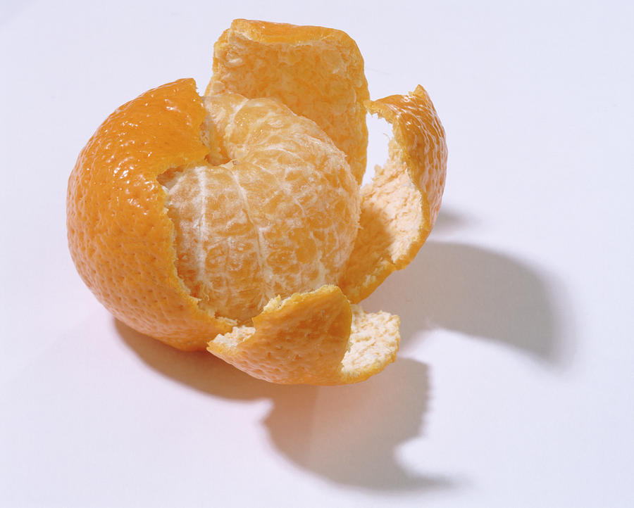 Peel orange on white background, close-up Photograph by John Foxx