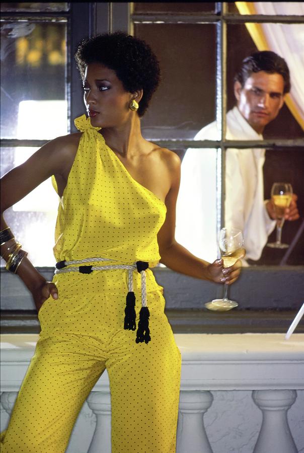 Peggy Dillard Wearing A Yellow One Shoulder Jumpsuit Photograph by Guy Le Baube