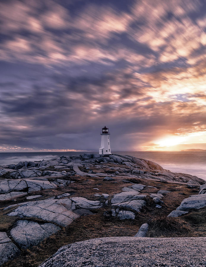 Peggys Cove lighthouse on a windy evening Photograph by Murray Rudd
