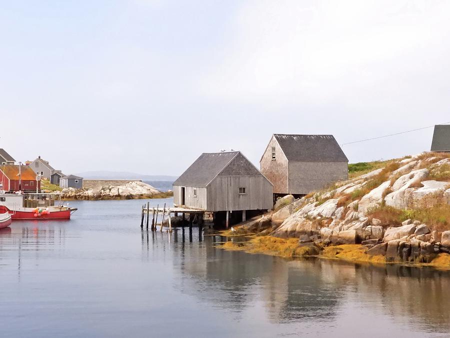 Peggys Cove Two Gray Sheds and Red Boat Photograph by Jennifer Wheatley Wolf