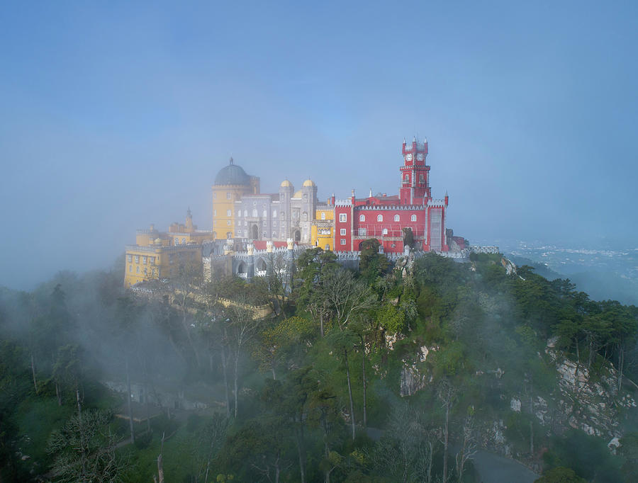 Pena Palace in fog and clouds in Sintra Photograph by Mikhail Kokhanchikov
