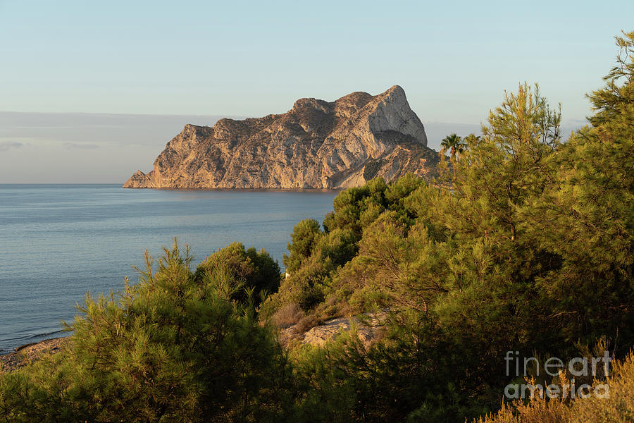 Penon de Ifach Natural Park and pine trees at sunrise Photograph by Adriana Mueller