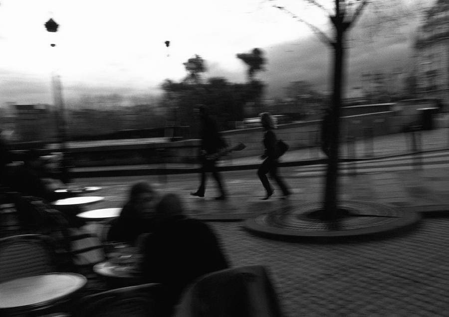 People at cafe terrace, blurred, b&w Photograph by Frederic Cirou