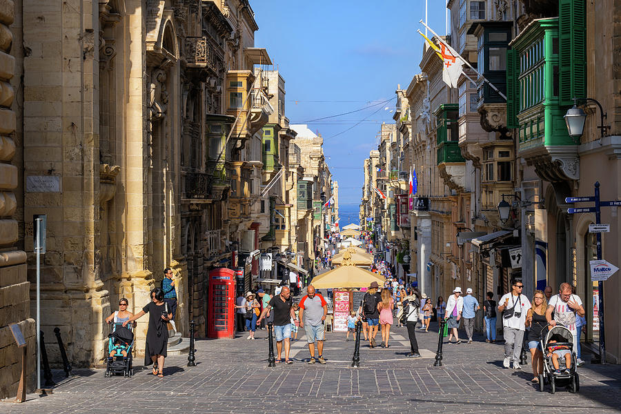 People at Merchants Street in Valletta City in Malta Photograph by Artur Bogacki
