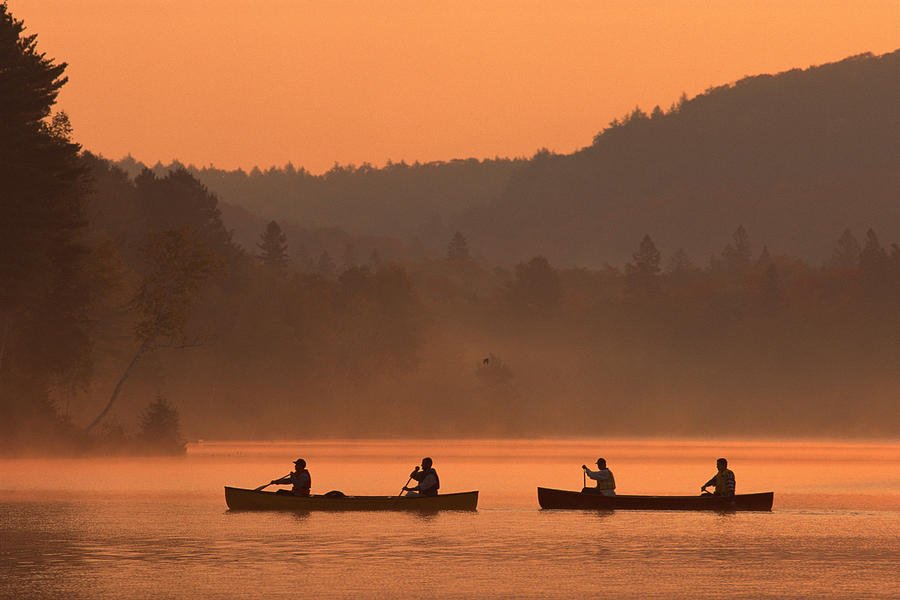 People canoeing on Oxtongue Lake Photograph by Comstock Images