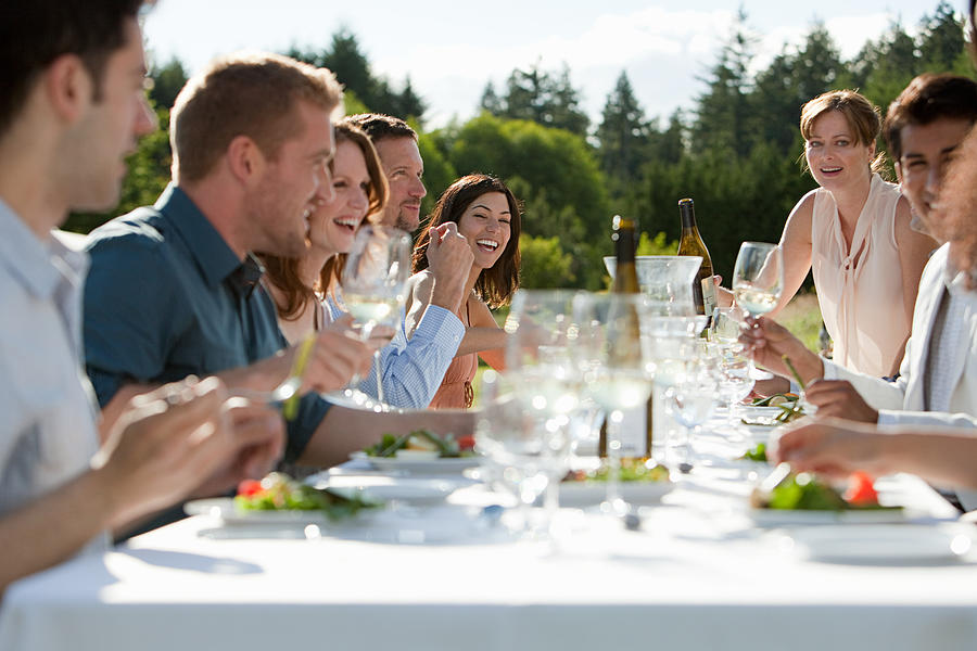 People enjoying outdoor dinner party Photograph by Image Source