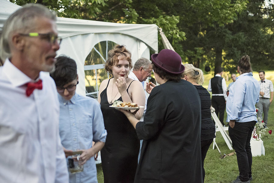 People getting meals from a food truck at a wedding. Photograph by Martinedoucet