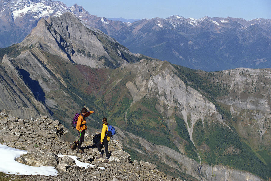 People hiking on mountains Photograph by Comstock Images