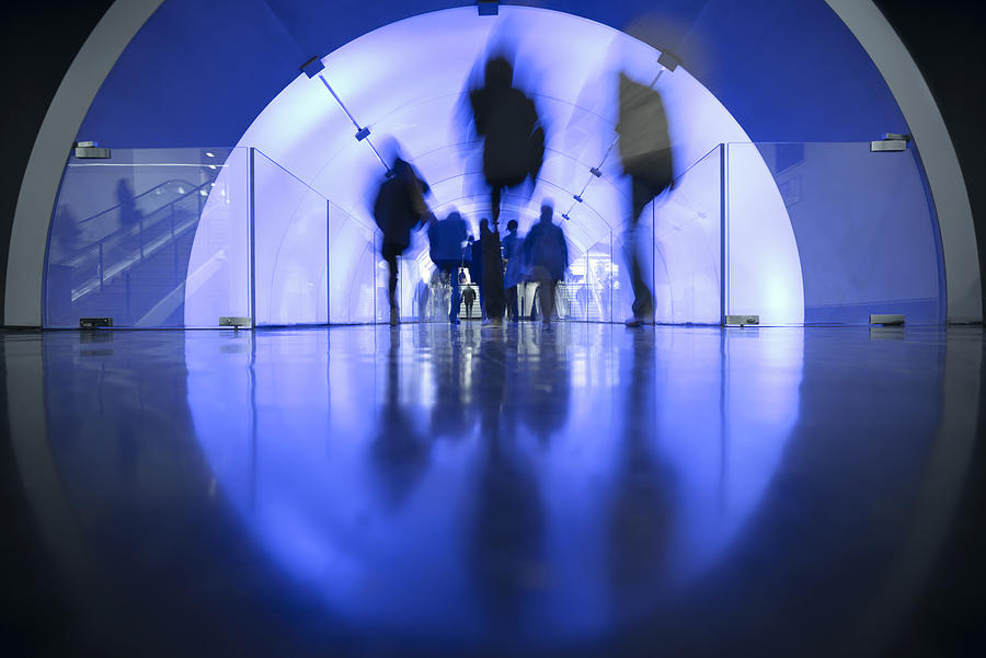 People passing LED illuminated tunnel Photograph by EschCollection