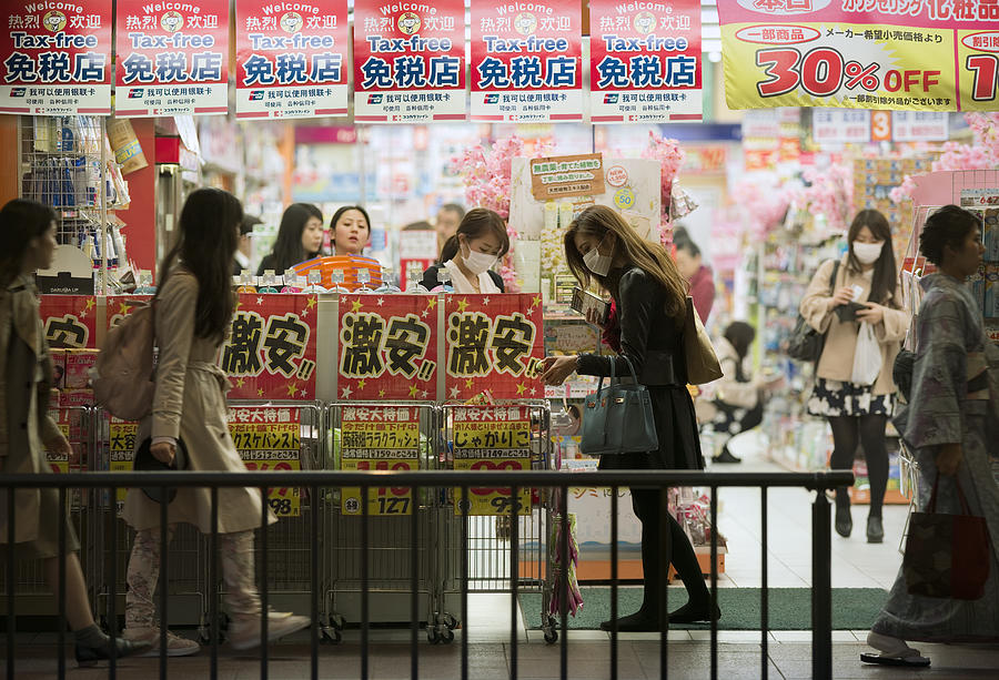 People shopping at a drugstore in Kyoto, Japan Photograph by EschCollection
