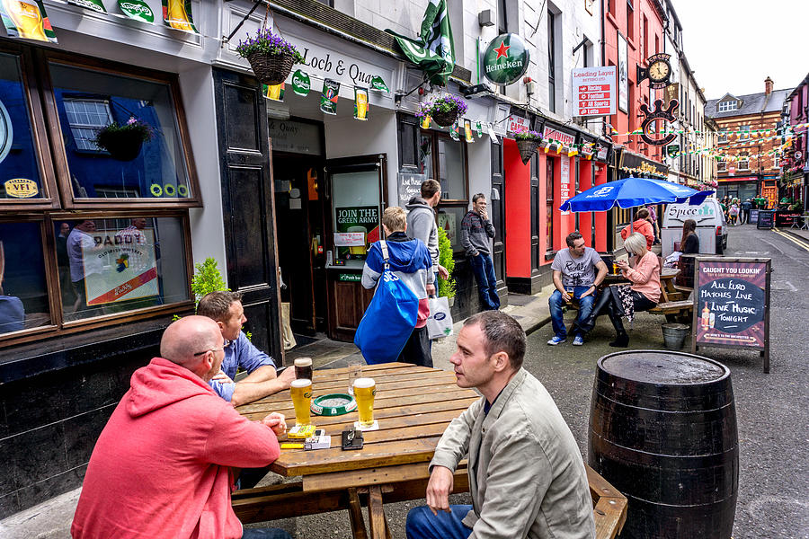 People sitting outside Irish pub in Wexford town centre Photograph by Tirc83