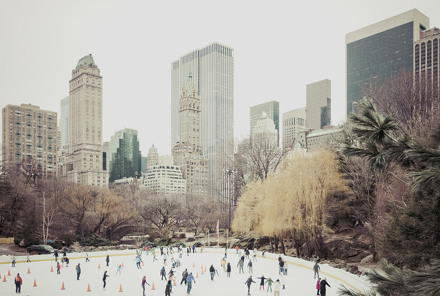 People skating on Wollman rink in Central Park Photograph by Miguel Sanz