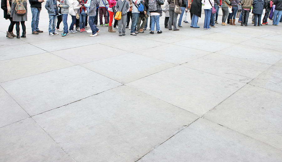 People standing in queue Photograph by Richard Newstead