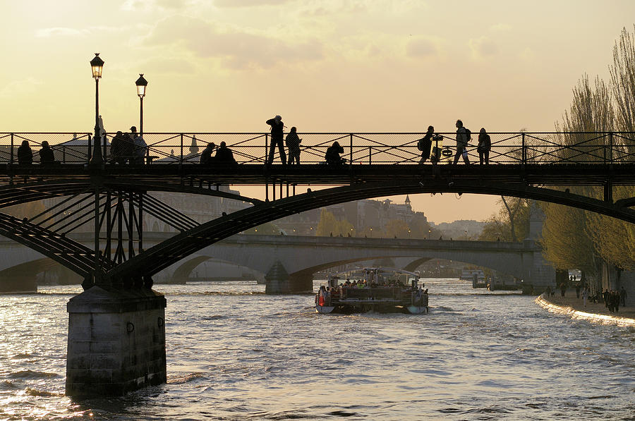 People taking in the view from Pont des Arts., Paris, France Photograph by Kevin Oke