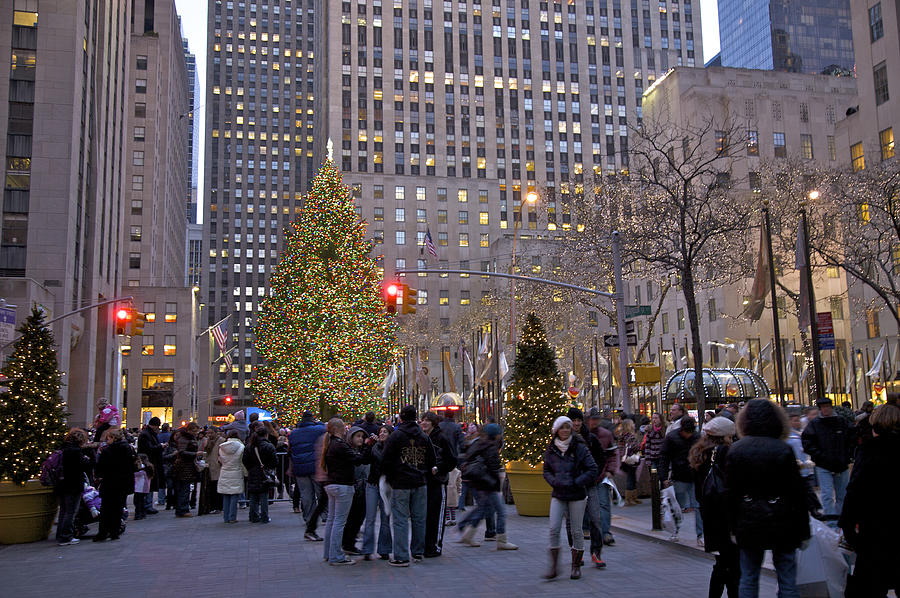 People viewing the Christmas tree at Rockefeller Center at dusk, New York, NY, USA Photograph by Barry Winiker