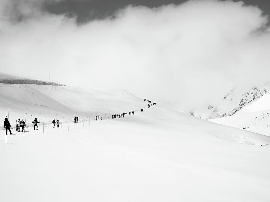 People Walking on Snow in a Single File Photograph by Pak Hong