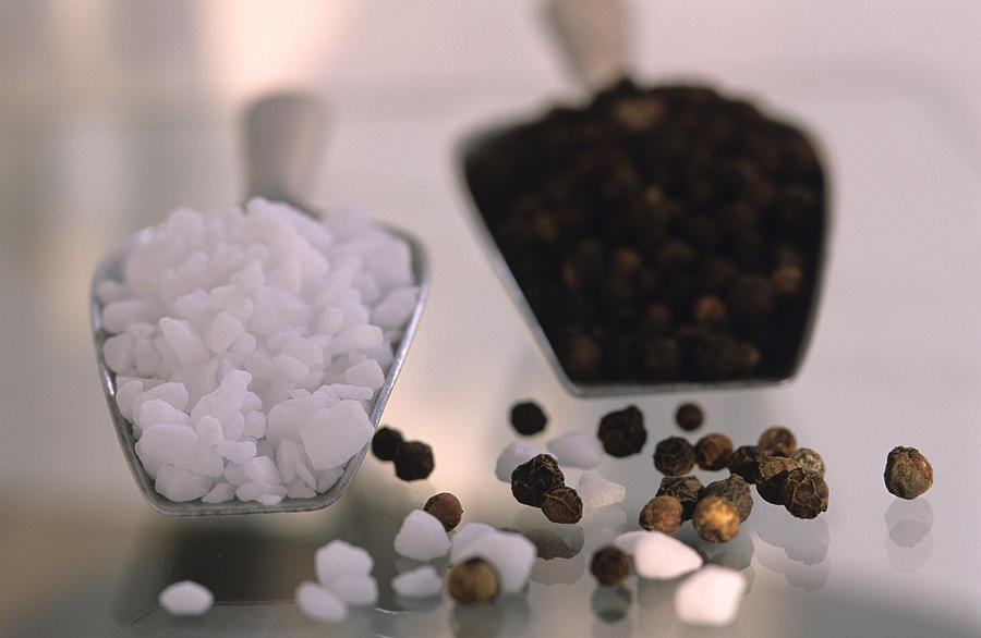 Pepper and rock salt, close-up Photograph by Achim Sass