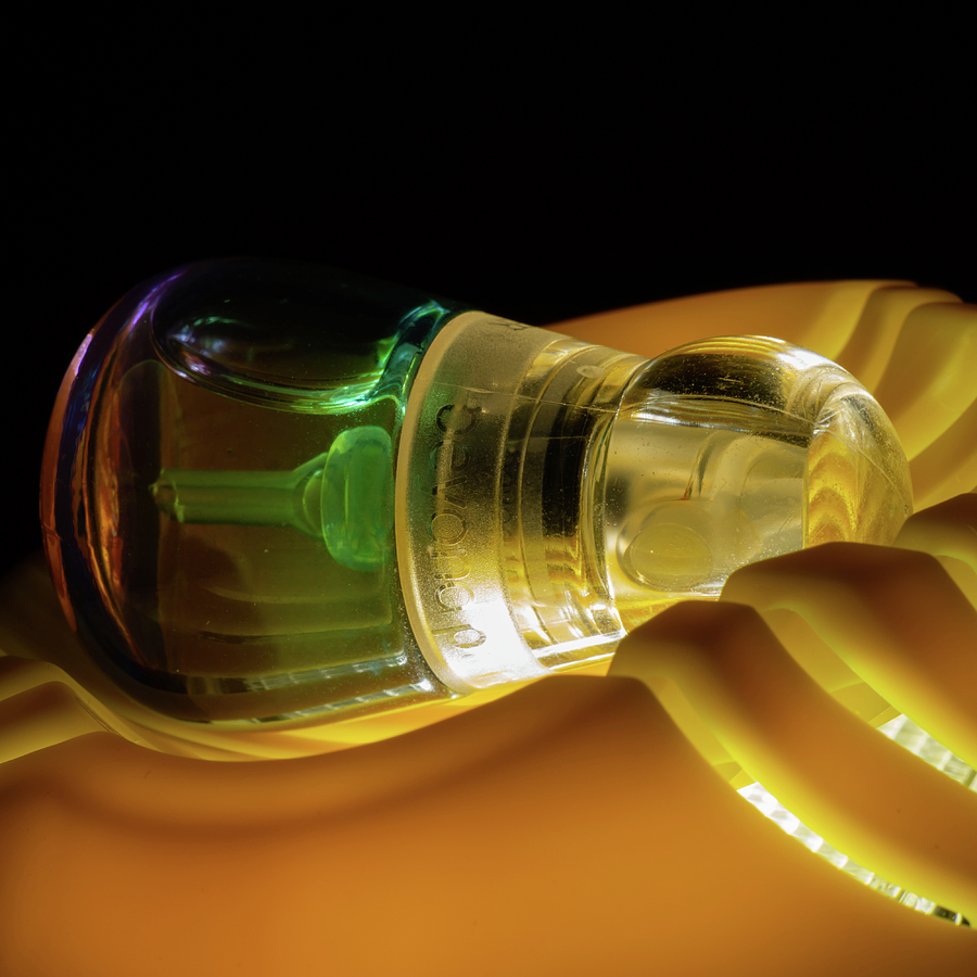 Green Perfume Bottle in Egg Slicer Photograph by Rolf Bertram