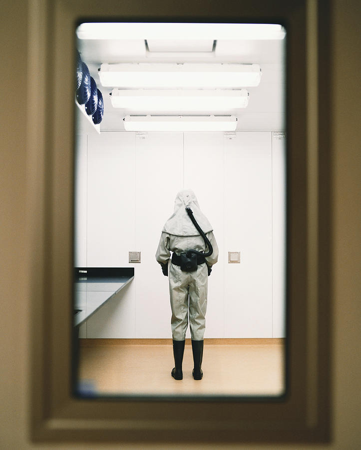 Person in a Lab Dressed in Protective Clothing Photograph by Noel Hendrickson