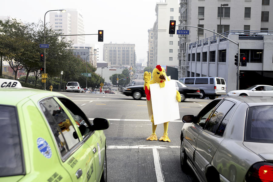 Person in chicken costume at crosswalk Photograph by Eric Chuang