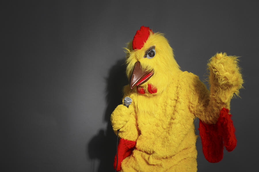 Person in chicken costume singing Photograph by Eric Chuang