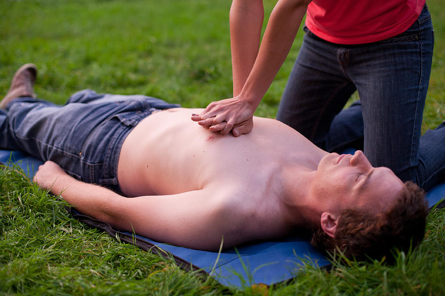 Person performing heart massage Photograph by JanekWD