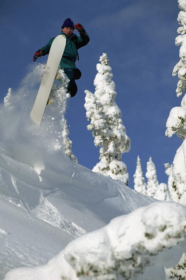 Person snowboarding Photograph by Comstock Images