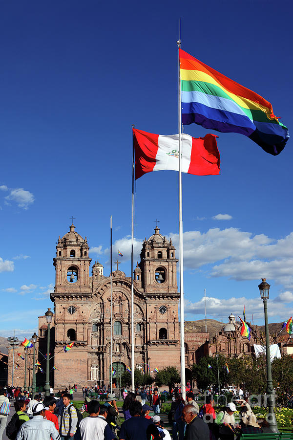 Peruvian and Cusco city flags and Compania de Jesus church Photograph by James Brunker