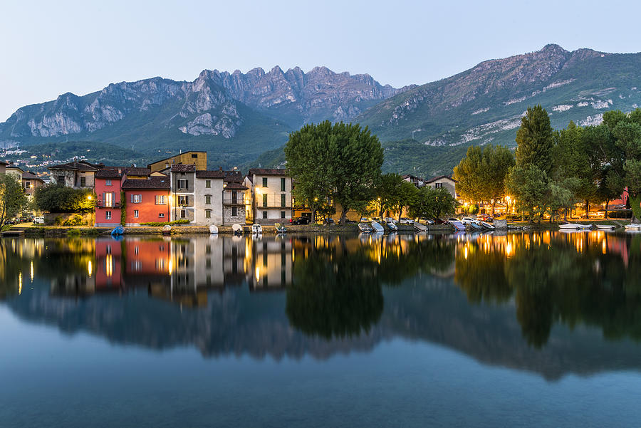 Pescarenico, Lecco, Lombardy. Pescarenico village at dusk. Resegone mountain in the background Photograph by Andrea Comi