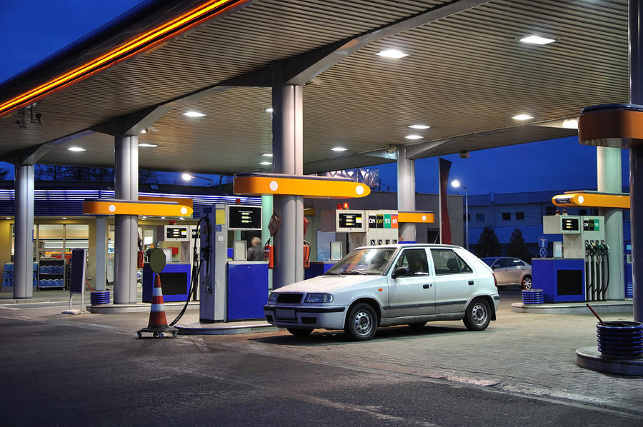 Petrol station at dusk Photograph by Madzia71