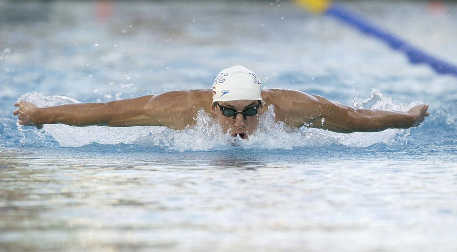 Phelps swims butterfly Photograph by Jed Jacobsohn
