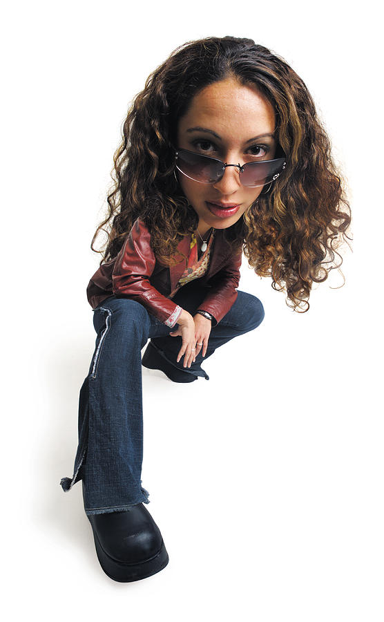 Photo Caricature Of A Female Teenager Wearing Sunglasses, And  Sitting On Her Foot With Her Leg Extended Forward Photograph by Photodisc