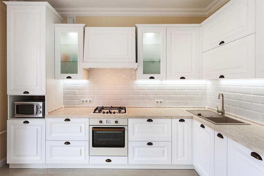 Photo of upscale interior with bright light kitchen cabinet and other designer elements Photograph by Brizmaker
