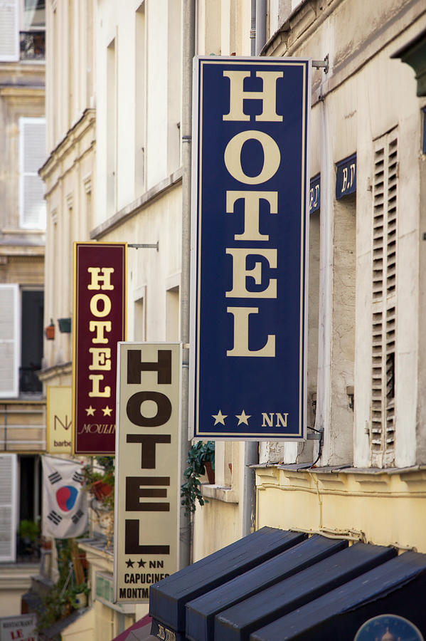 Photograph Of A European Street Lined With Multiple Hotel Signs Photograph by Photodisc