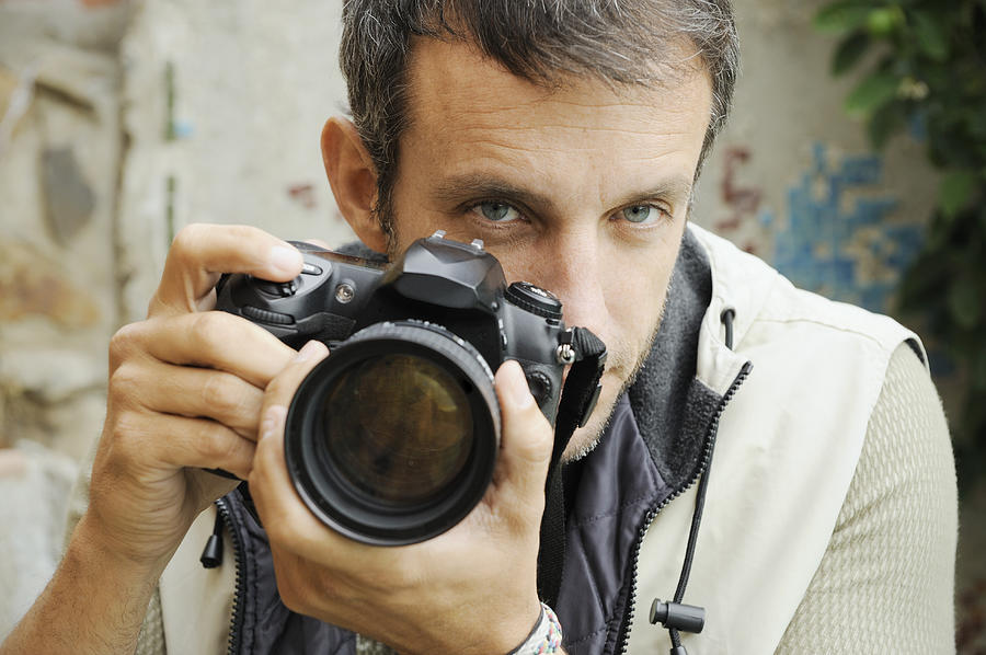 Photographer looking over lens. Photograph by David Malan