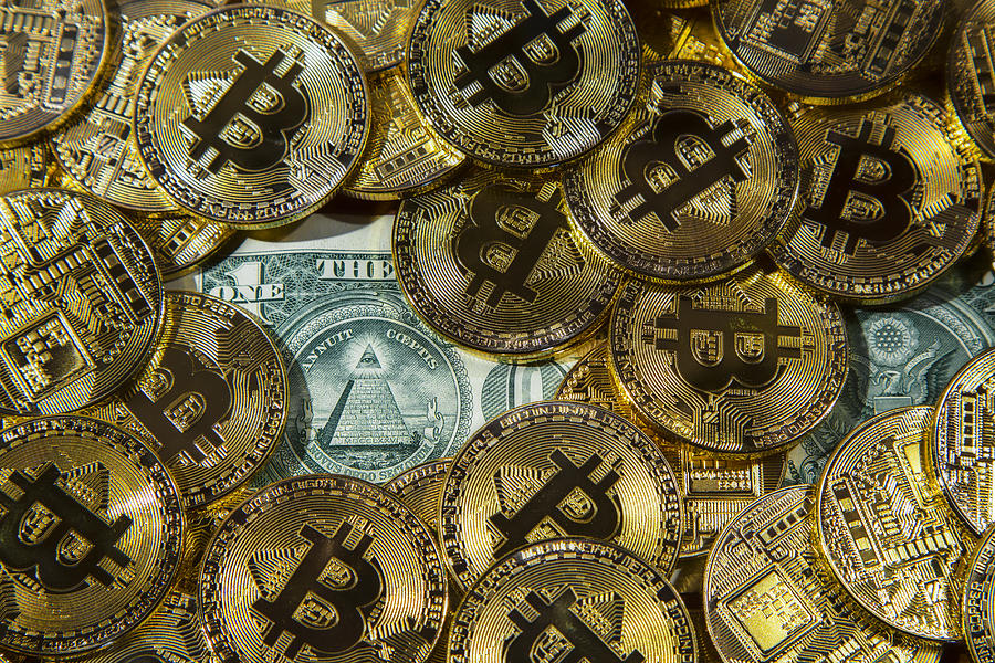 Physical version of Bitcoin coin aka virtual money. Photograph by David Trood