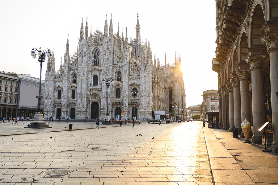 Piazza del Duomo (Cathedral Square) at sunrise, Milan, Italy Photograph by © Marco Bottigelli