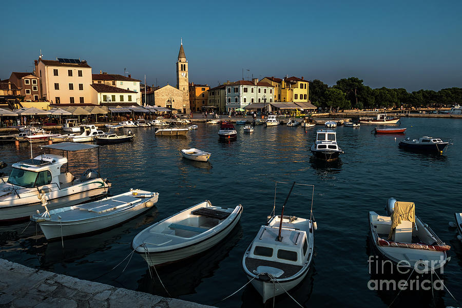 Picturesque Village Fazana In Croatia With Old Church And Boats In Harbor Photograph by Andreas Berthold
