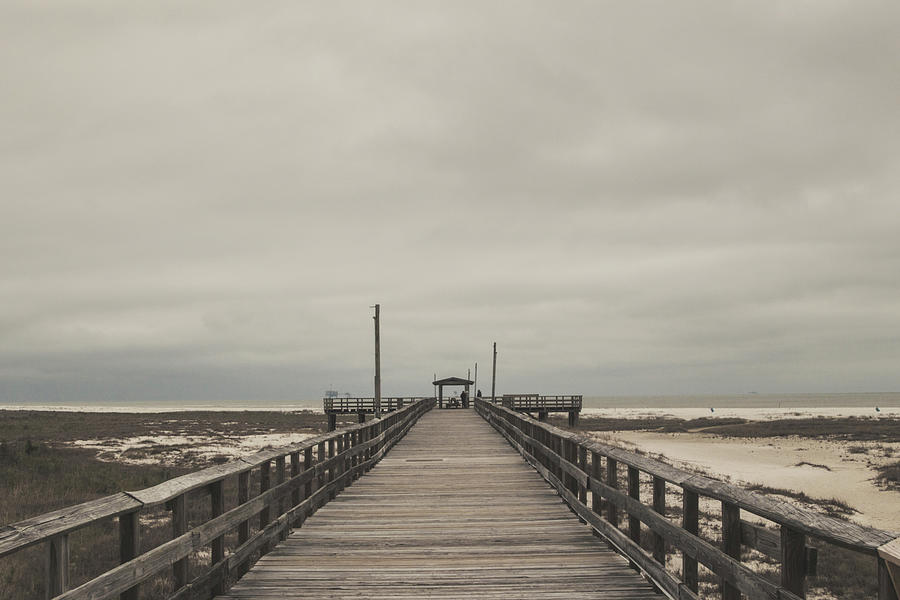 Pier Under Clouds Photograph by Eugene Campbell