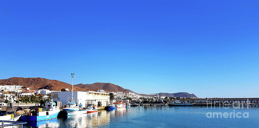 Pier views, boats, mountains, colours of blue.,  Photograph by Francesca Mackenney