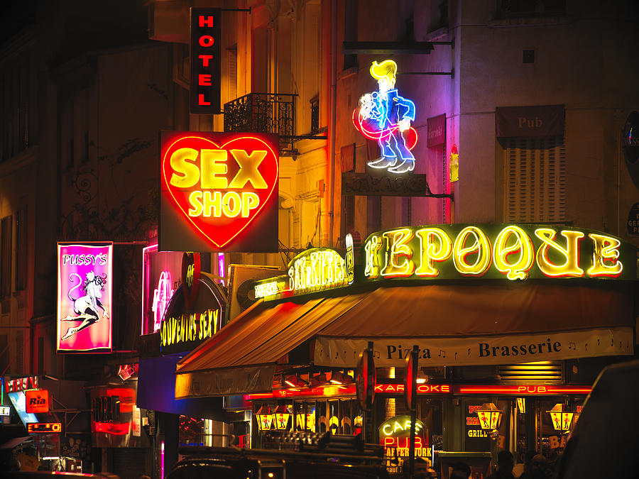 Pigalle district in Paris at night Photograph by Gary Yeowell